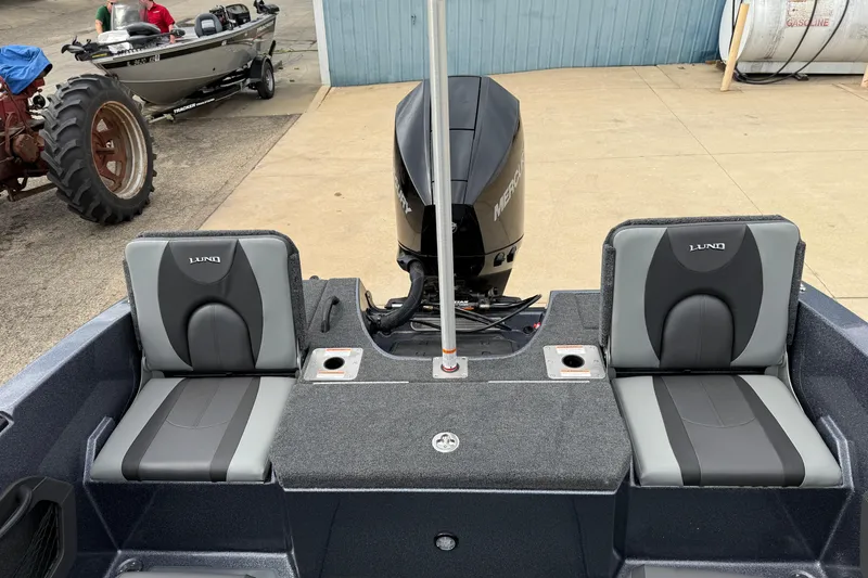 Slide: The Image of 2026 Lund 189 Tyee GL boat interior with storage compartment and seating. - 28