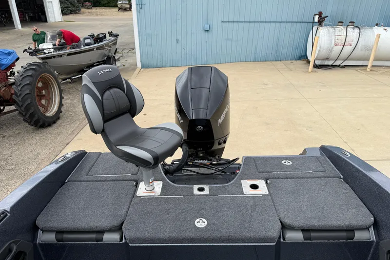 Slide: The Image of Battery compartment of 2026 Lund 189 Tyee GL boat with NOCO Boost Pro charger. - 32