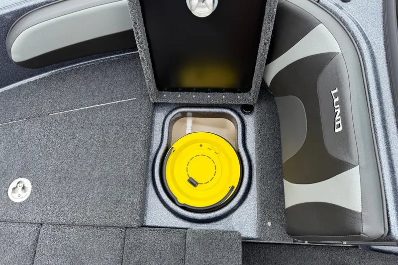 Slide: The Image of 2026 Lund 189 Tyee GL boat storage compartment with yellow lid and secure lock. - 33