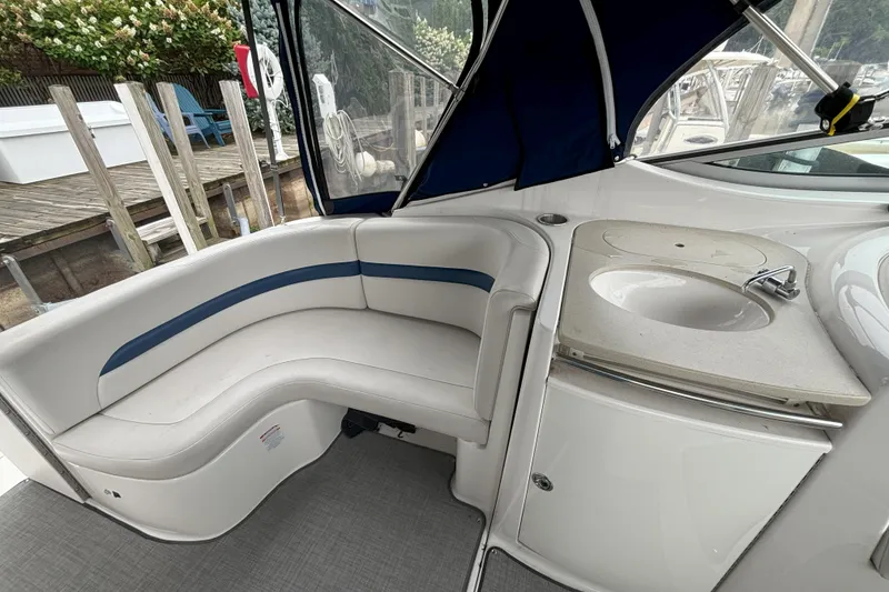 Slide: The Image of 2003 Chaparral 310 Signature boat interior with seating and sink area. - 11
