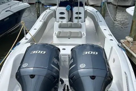 Slide: The Image of 2022 Cape Horn 32 T boat with dual 300 HP engines docked at marina. - 1