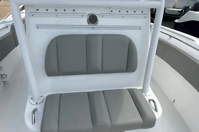 Slide: The Image of 2022 Cape Horn 32 T boat with gray cushioned seating and white frame. - 11