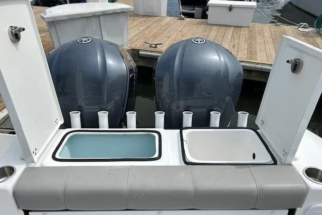 Slide: The Image of 2022 Cape Horn 32 T boat with dual engines and fishing rod holders. - 13