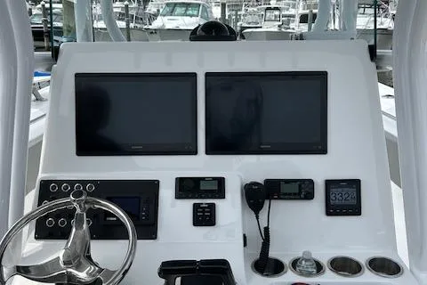 Slide: The Image of 2022 Cape Horn 32 T boat dashboard with dual screens and navigation controls. - 15
