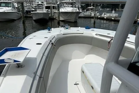 Slide: The Image of 2022 Cape Horn 32 T boat docked at marina, featuring spacious deck and seating. - 4