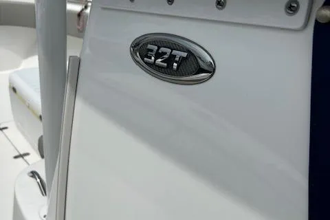 Slide: The Image of 2022 Cape Horn 32 T boat emblem on sleek white surface. - 5