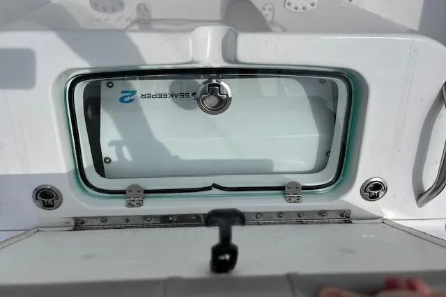 Slide: The Image of 2022 Cape Horn 32 T boat with SeaKeeper compartment, featuring a secure latch system. - 6