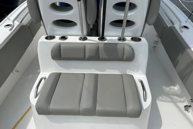 Slide: The Image of 2022 Cape Horn 32 T boat seating with gray cushions and cup holders. - 7