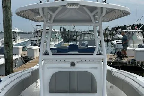 Slide: The Image of 2022 Cape Horn 32 T boat docked at marina, featuring sleek design and spacious deck. - 9