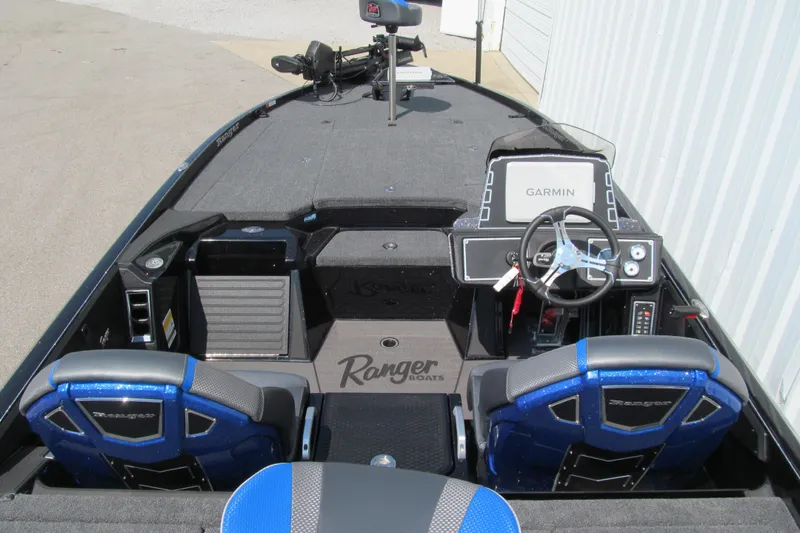 Slide: The Image of 2026 Ranger Z520 boat interior with Garmin navigation, dual seats, and steering wheel. - 5