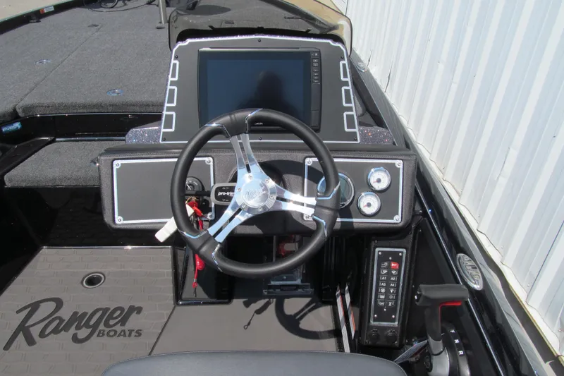 Slide: The Image of 2026 Ranger Z520 boat dashboard with steering wheel and control panel. - 6