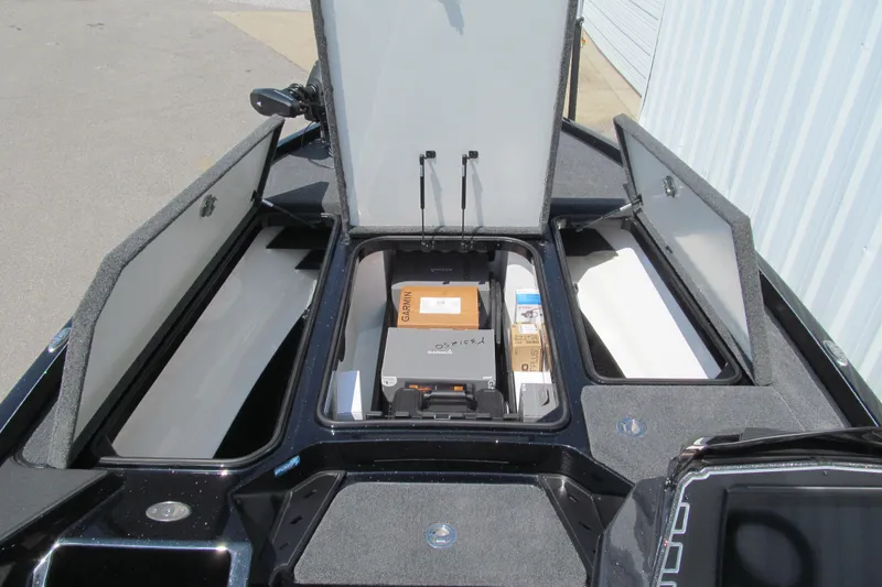 Slide: The Image of 2026 Ranger Z520 boat storage compartments with equipment and gear. - 8