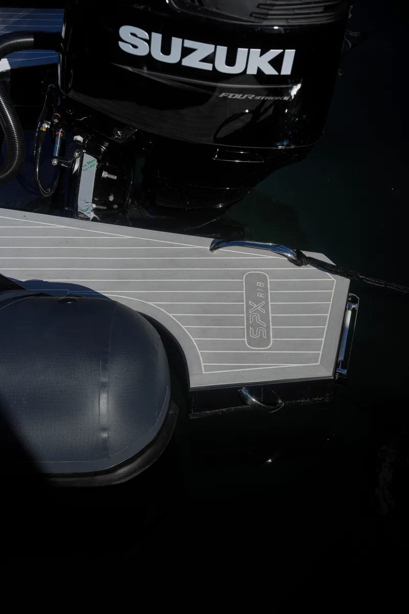 Slide: The Image of 2023 SPX RIB 25 Dinette with Suzuki outboard motor. - 14