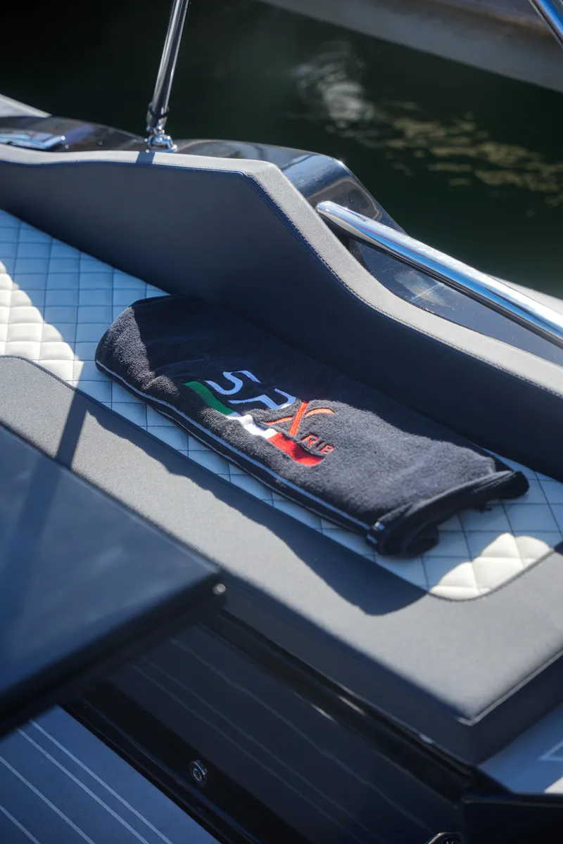 Slide: The Image of 2023 SPX RIB 25 Dinette boat interior with branded towel. - 23