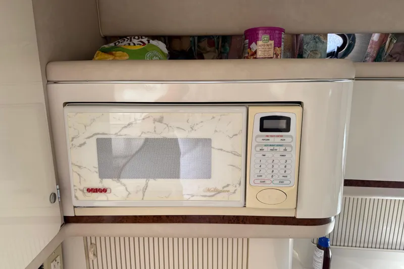 Slide: The Image of Built-in microwave in 1996 Sea Ray 330 Sundancer yacht kitchen area. - 30