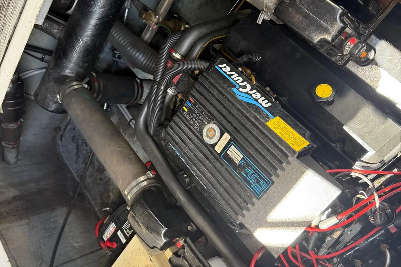 Slide: The Image of Engine compartment of a 1996 Sea Ray 330 Sundancer with MerCruiser components. - 42