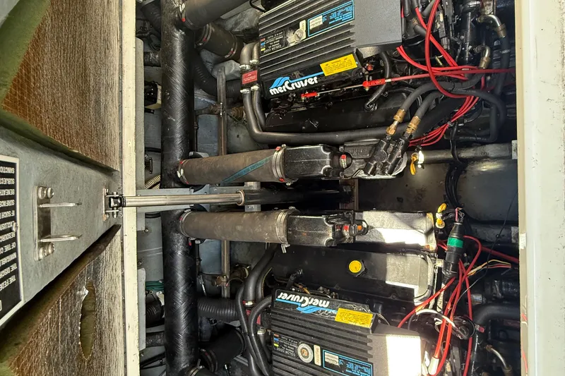 Slide: The Image of Engine compartment of a 1996 Sea Ray 330 Sundancer with MerCruiser engines. - 43