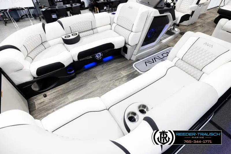 Slide: The Image of Luxurious 2026 Avalon Excal LTD CRB boat interior with plush white seating and modern amenities. - 10