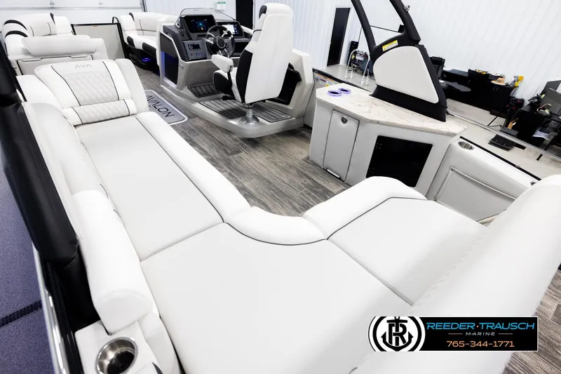 Slide: The Image of Luxurious interior of 2026 Avalon Excal LTD CRB boat with plush seating and modern helm. - 11
