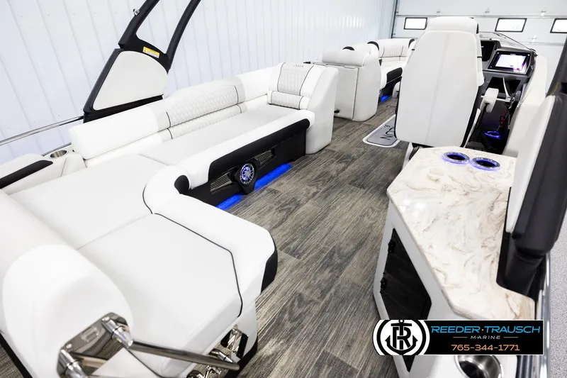 Slide: The Image of Luxurious interior of 2026 Avalon Excal LTD CRB boat with modern seating and wood flooring. - 12