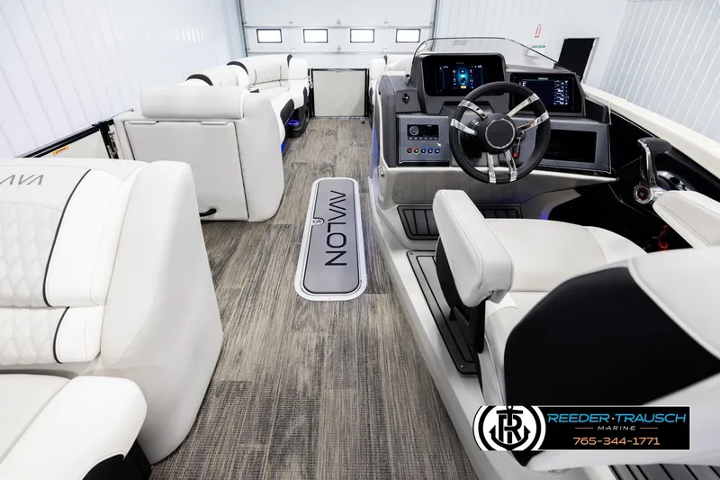 Slide: The Image of Luxurious interior of 2026 Avalon Excal LTD CRB boat with modern dashboard and seating. - 17