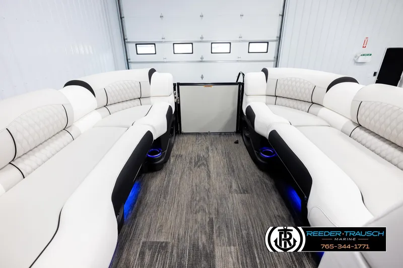 Slide: The Image of Luxurious interior of 2026 Avalon Excal LTD CRB boat with plush seating and ambient lighting. - 18