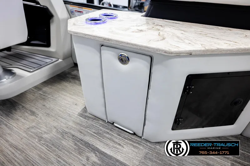 Slide: The Image of 2026 Avalon Excal LTD CRB boat interior with marble countertop and storage compartments. - 28