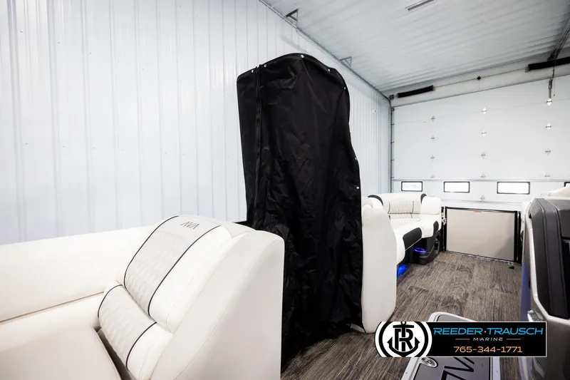 Slide: The Image of 2026 Avalon Excal LTD CRB interior with white seating in a garage setting. - 31