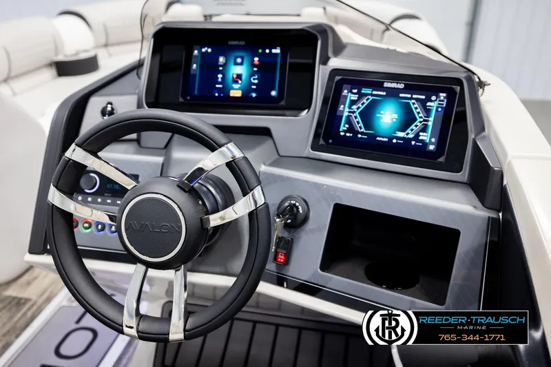 Slide: The Image of Steering console of 2026 Avalon Excal LTD CRB with digital displays and controls. - 32