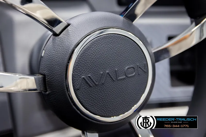 Slide: The Image of Steering wheel of 2026 Avalon Excal LTD CRB with chrome accents and logo. - 34
