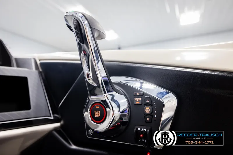 Slide: The Image of 2026 Avalon Excal LTD CRB throttle control with start/stop button, sleek design. - 39