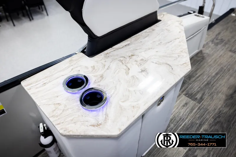 Slide: The Image of Luxurious Avalon Excal LTD CRB 2026 boat interior with marble countertop and illuminated cup holders. - 43