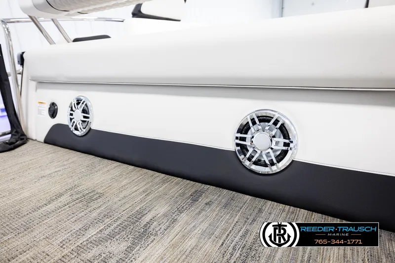 Slide: The Image of 2026 Avalon Excal LTD CRB boat interior with sleek speaker design and modern flooring. - 49