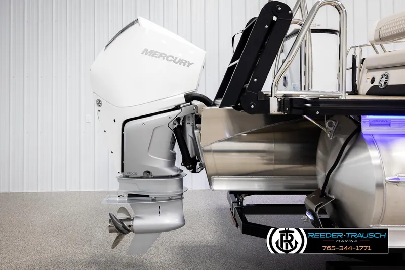 Slide: The Image of 2026 Avalon Excal LTD CRB boat with Mercury outboard motor in showroom. - 50