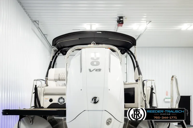 Slide: The Image of Avalon Excal LTD CRB 2026 boat with V8 engine in a storage facility. - 7