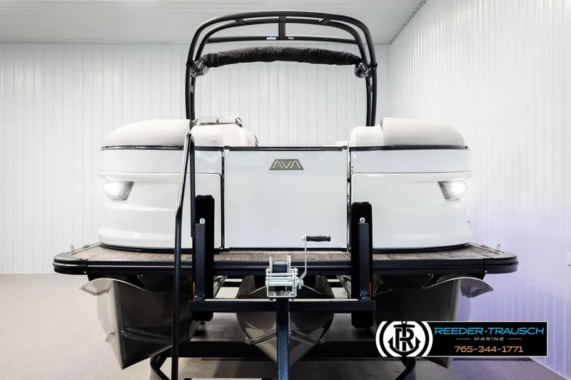Slide: The Image of 2026 Avalon Excal LTD CRB pontoon boat in showroom, front view with sleek design. - 8