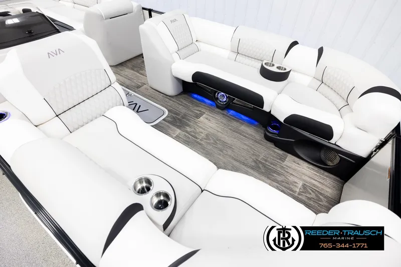 Slide: The Image of Luxurious interior of 2026 Avalon Excal LTD CRB boat with white seating and blue lighting. - 9