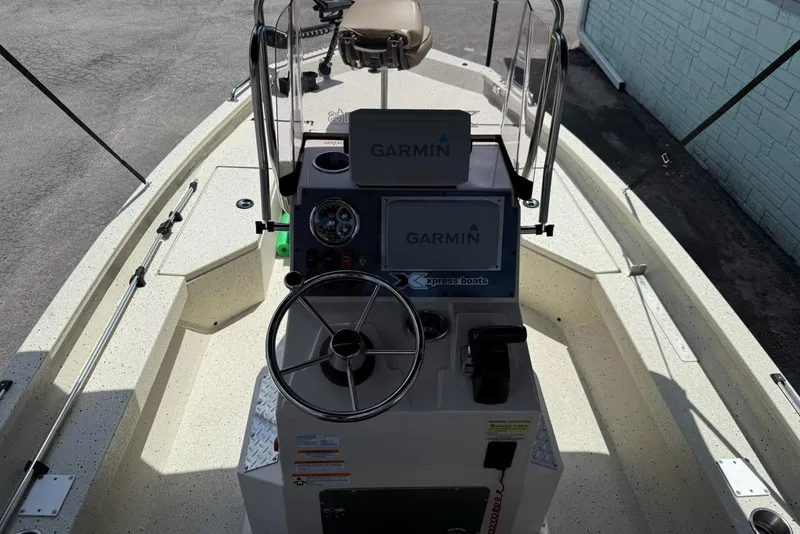 Slide: The Image of 2022 Xpress H20 BAY boat interior with Garmin navigation system and steering wheel. - 6