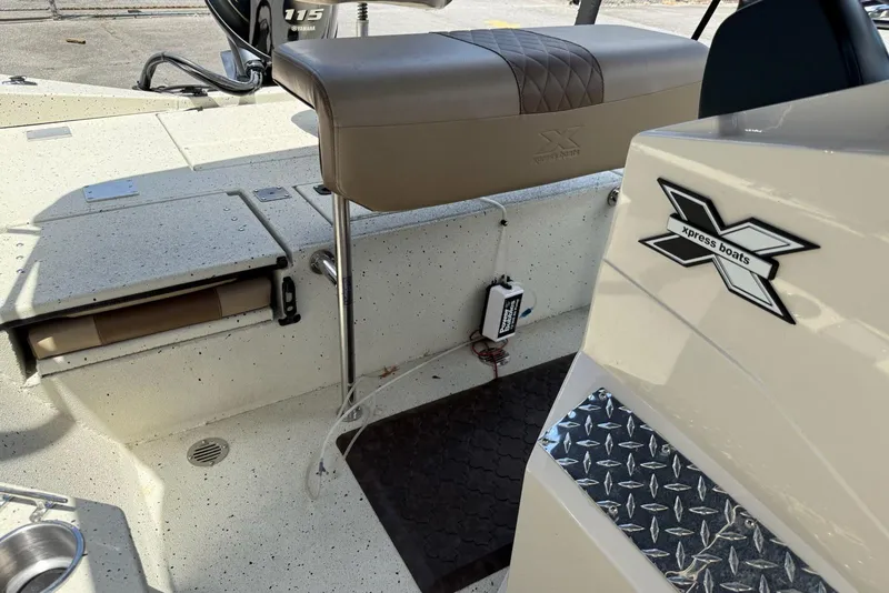 Slide: The Image of 2022 Xpress H20 BAY boat interior with seating and Yamaha 115 engine. - 7