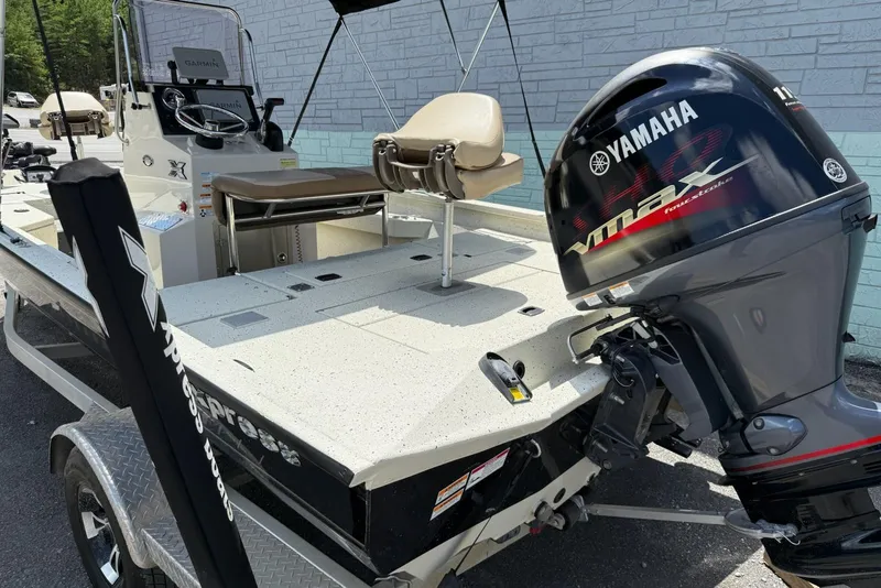 Slide: The Image of 2022 Xpress H20 BAY boat with Yamaha VMAX engine, parked on a trailer. - 9