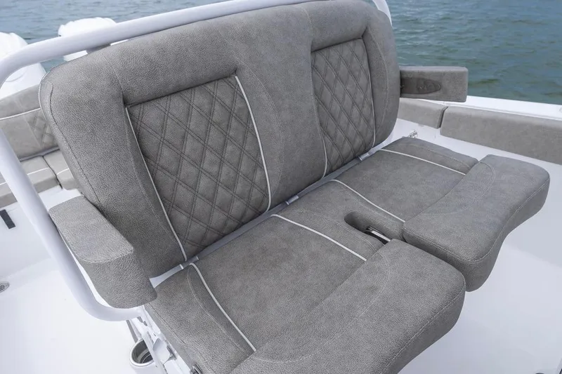 Slide: The Image of 2026 Sea Hunt Ultra 265 SE boat seat with gray upholstery and diamond stitching. - 13