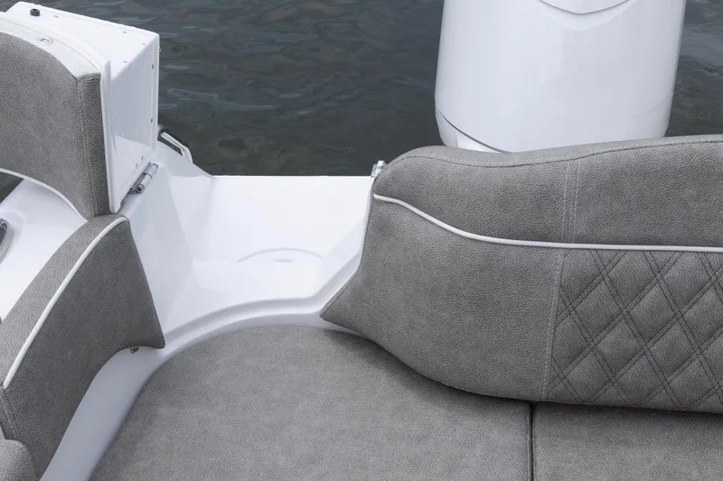 Slide: The Image of 2026 Sea Hunt Ultra 265 SE boat seating with gray upholstery and diamond stitching. - 19