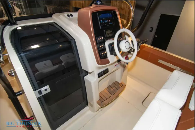 Slide: The Image of 2024 Capoforte FX270 boat cockpit with modern controls and seating. - 14