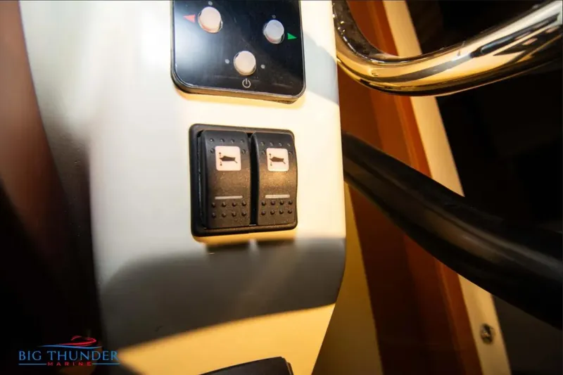 Slide: The Image of Control panel of 2024 Capoforte FX270 boat with switches and buttons. - 16