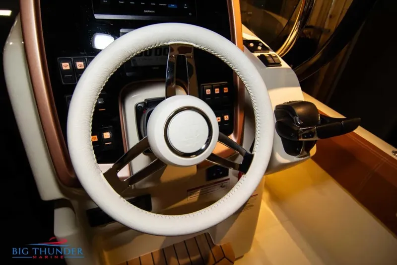 Slide: The Image of 2024 Capoforte FX270 boat steering wheel and control panel, featuring modern design and technology. - 17