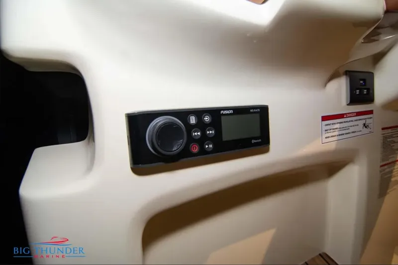 Slide: The Image of 2024 Capoforte FX270 boat interior with Fusion MS-RA70 stereo system. - 18