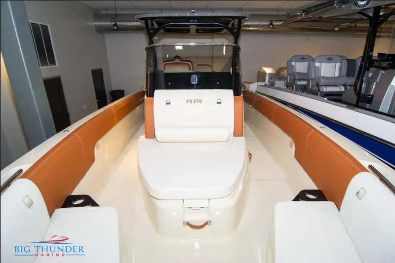 Slide: The Image of 2024 Capoforte FX270 boat interior with tan seating, showcased at Big Thunder Marine. - 27