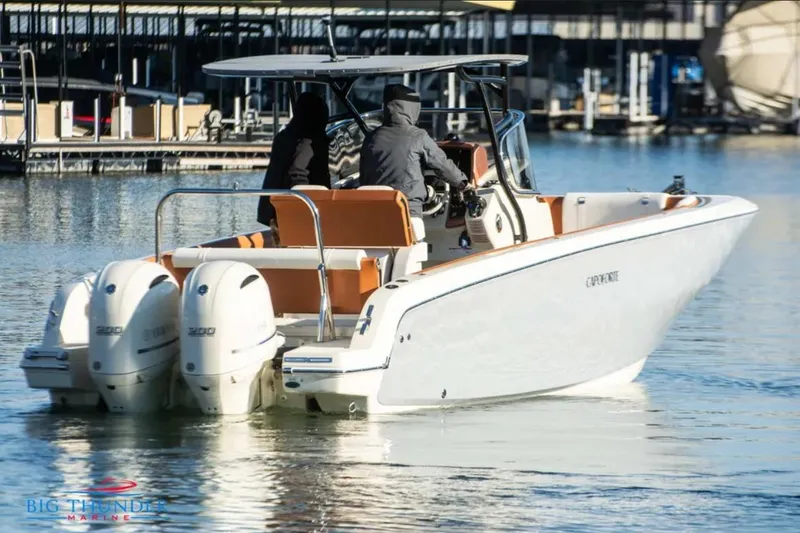Slide: The Image of 2024 Capoforte FX270 boat with dual engines on a calm marina. - 4