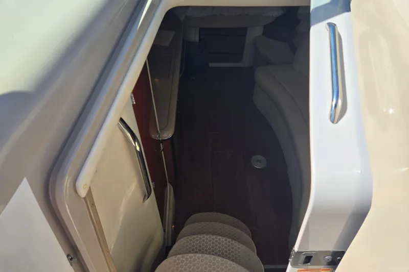 Slide: The Image of Interior view of 2003 Sea Ray 340 Sundancer cabin entrance with steps and seating. - 17