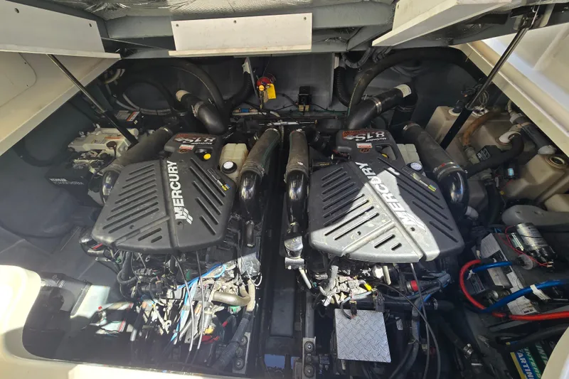 Slide: The Image of Engine compartment of a 2003 Sea Ray 340 Sundancer with twin Mercury engines. - 26